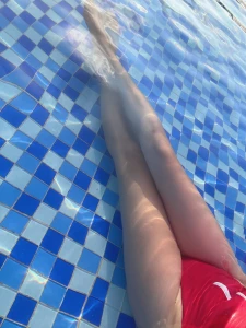 Legs and feet, wading in a Sanya swimming pool