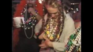 Jaime L does a pose after saying happy mardi gras with her tits out, then shows off a nice round ass