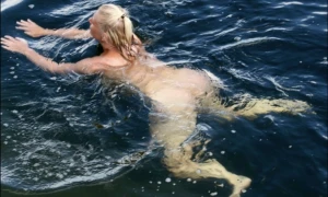 Blonde nude by the lake