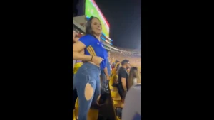 Mexican female fan Carla Garza lifting up her shirt showing her boobs in  stadium, public nudity 3612578