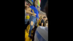 Mexican female fan Carla Garza lifting up her shirt showing her boobs in  stadium, public nudity 3612588