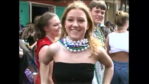 Carla T happily shows off her perky pair for the cameras at mardi gras