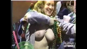 Stephanie B showing off her big milky white teacher titties for the crowd at mardi gras