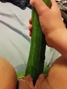 Pissing while fucking a cucumber