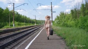 Nude traveling with hat and heels only